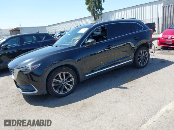 2016 Mazda CX-9 Grand Touring with VIN JM3TCBDY4G0113693, listed as a IAAI auction lot 41965857 with 152,403 mi miles and . Bid and sale history available at DreamBid. Image 18.