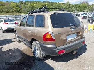 2004 Hyundai Santa Fe GLS z VIN KM8SC73EX4U814067, wystawiony jako IAAI lot #40404373 z przebiegiem 182 101 mil mil oraz . Historia ofert i sprzedaży dostępna na DreamBid. Obrazek 3.
