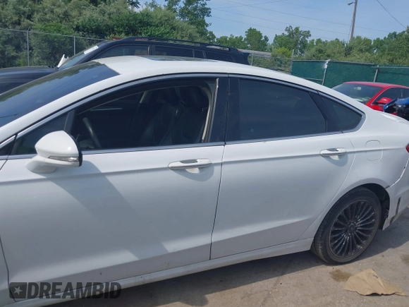2016 Ford Fusion Titanium with VIN 3FA6P0K99GR317034, listed as a IAAI auction lot 42590288 with 200,468 mi miles and . Bid and sale history available at DreamBid. Image 14.