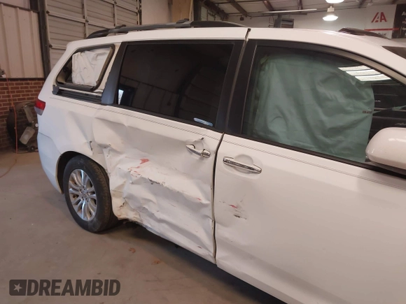 2011 Toyota Sienna XLE AAS with VIN 5TDYK3DC5BS130066, listed as a IAAI auction lot 41294340 with 156,591 mi miles and . Bid and sale history available at DreamBid. Image 6.