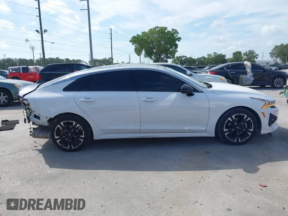2022 Kia K5 GT-Line z VIN 5XXG64J24NG114772, wystawiony jako IAAI lot #42161747 z przebiegiem 60 761 mil mil oraz . Historia ofert i sprzedaży dostępna na DreamBid. Obrazek 14.
