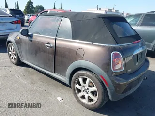 2010 MINI Convertible with VIN WMWMR3C50ATU97550, listed as a IAAI auction lot 41709012 with 86,499 mi miles and . Bid and sale history available at DreamBid. Image 3.