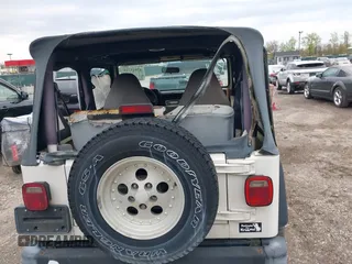 1998 Jeep Wrangler Sport with VIN 1J4FY19S0WP779147, listed as a IAAI auction lot 42045723 with 205,822 mi miles. Bid and sale history available at carsss.com. Image 15.