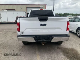 2019 Ford F-150 XL with VIN 1FTFX1E54KKD11857, listed as a IAAI auction lot 42141854 with 105,585 mi miles. Bid and sale history available at carsss.com. Image 1.