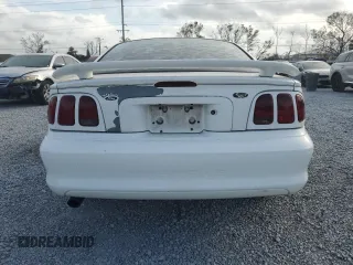 1997 Ford Mustang with VIN 1FALP4044VF174876, listed as a Copart auction lot 41601355 with 103,828 mi miles and Salvage Title. Bid and sale history available at carsss.com. Image 6.