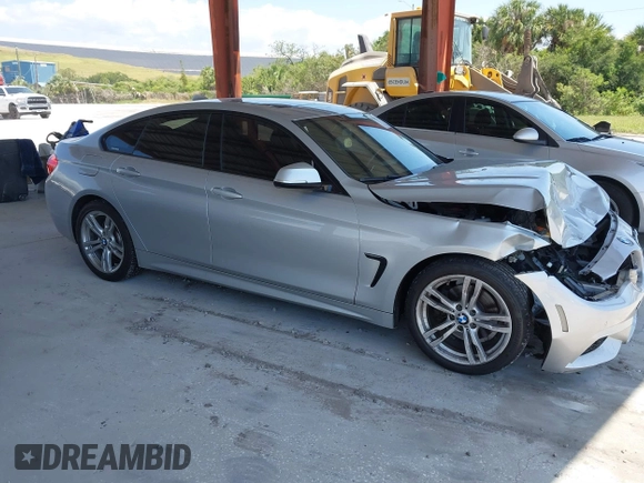 2015 BMW 4 Series 428i with VIN WBA4A5C58FD410076, listed as a IAAI auction lot 39384271 with 125,987 mi miles and . Bid and sale history available at DreamBid. Image 1.