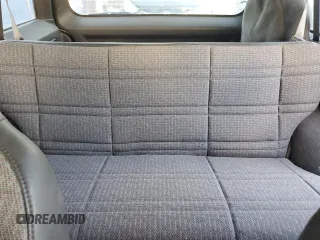 1999 Jeep Cherokee Sport with VIN 1J4FT68S6XL578679, listed as a Copart auction lot 76697394 with 196,110 mi miles and Salvage title. Bid and sale history available at DreamBid. Image 10.