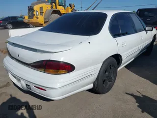 1999 Pontiac Bonneville SE z VIN 1G2HX52KXXH254051, wystawiony jako IAAI lot #41990245 z przebiegiem 213 000 mil mil oraz . Historia ofert i sprzedaży dostępna na DreamBid. Obrazek 4.