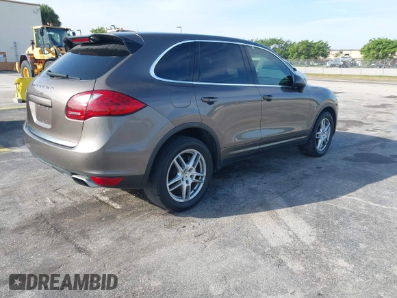 2011 Porsche Cayenne S Hybrid with VIN WP1AE2A29BLA94414, listed as a IAAI auction lot 41644386 with 76,095 mi miles. Bid and sale history available at carsss.com. Image 4.