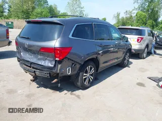 2016 Honda Pilot EX-L with VIN 5FNYF6H54GB083139, listed as a IAAI auction lot 42150923 with 213,009 mi miles and . Bid and sale history available at DreamBid. Image 4.