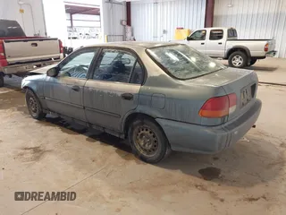 1998 Honda Civic DX with VIN JHMEJ6622WS000401, listed as a IAAI auction lot 41588057 with 296,638 mi miles. Bid and sale history available at carsss.com. Image 3.