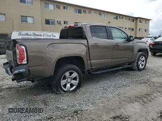 2015 GMC Canyon 4WD SLE with VIN 1GTG6BE38F1263139, listed as a Copart auction lot 75479854 with 124,765 mi miles and Salvage Title. Bid and sale history available at carsss.com. Image 3.