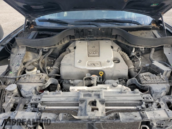 2015 Infiniti QX70 z VIN JN8CS1MUXFM381307, wystawiony jako Copart lot #47267545 z przebiegiem 171 240 mil mil oraz Szkoda całkowita • Salvage title. Historia ofert i sprzedaży dostępna na DreamBid. Obrazek 11.