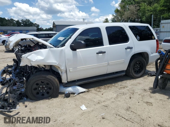 2014 Chevrolet Tahoe Commercial with VIN 1GNLC2E04ER202441, listed as a Copart auction lot 61310725 with 117,443 mi miles and Salvage title. Bid and sale history available at DreamBid. Image 1.