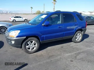 2005 Kia Sportage LX with VIN KNDJF723457057402, listed as a IAAI auction lot 41471742 with 215,565 mi miles and . Bid and sale history available at carsss.com. Image 2.