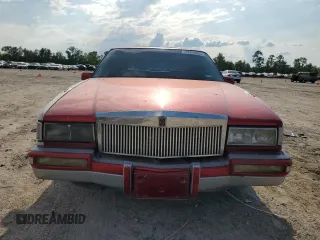 1991 Cadillac DeVille z VIN 1G6CD53B2M4335645, wystawiony jako Copart lot #53390805 z przebiegiem 210 451 mil mil oraz Szkoda całkowita • Salvage title. Historia ofert i sprzedaży dostępna na DreamBid. Obrazek 5.