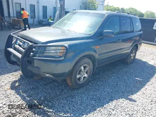 2006 Honda Pilot EX-L with VIN 2HKYF187X6H557468, listed as a IAAI auction lot 42017101 with 213,425 mi miles and . Bid and sale history available at carsss.com. Image 2.