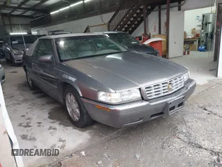 1999 Cadillac Eldorado ESC with VIN 1G6EL12Y8XU612393, listed as a IAAI auction lot 41761839 with 104,994 mi miles. Bid and sale history available at carsss.com. Image 1.