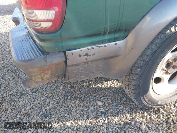 1999 Ford Explorer Sport with VIN 1FMYU24E6XUB80611, listed as a IAAI auction lot 41858826 with 209,656 mi miles and . Bid and sale history available at DreamBid. Image 12.