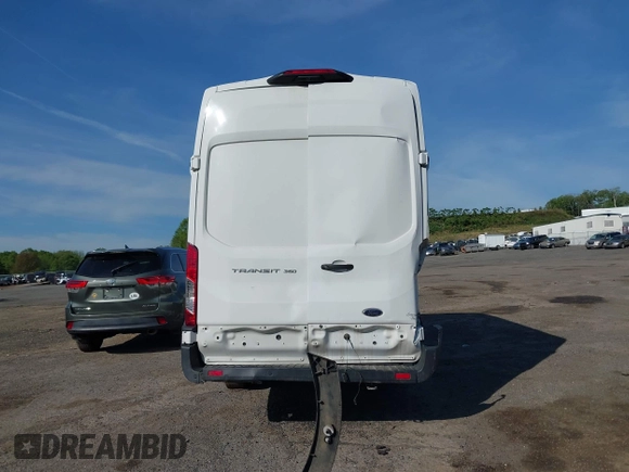 2021 Ford Transit Cargo z VIN 1FTBW3X84MKA60720, wystawiony jako IAAI lot #42202665 z przebiegiem 67 295 mil mil oraz . Historia ofert i sprzedaży dostępna na DreamBid. Obrazek 17.