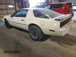 1984 Pontiac Firebird z VIN 1G2AS87H8EL260830, wystawiony jako Copart lot #84198714 z przebiegiem 95 966 mil mil oraz Szkoda całkowita • Salvage title. Historia ofert i sprzedaży dostępna na DreamBid. Obrazek 2.
