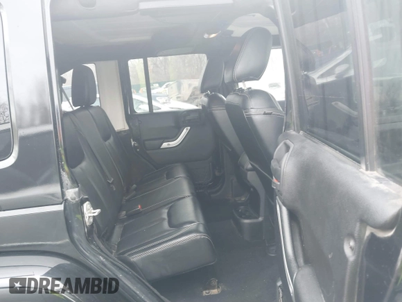 2015 Jeep Wrangler Unlimited Rubicon Hard Rock with VIN 1C4HJWFG9FL569962, listed as a IAAI auction lot 41557801 with 78,597 mi miles and . Bid and sale history available at DreamBid. Image 8.