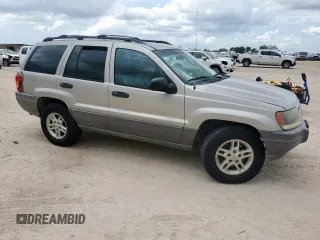 2003 Jeep Grand Cherokee Laredo with VIN 1J4GX48S13C609036, listed as a Copart auction lot 63143505 with 127,188 mi miles and Clean title. Bid and sale history available at DreamBid. Image 4.