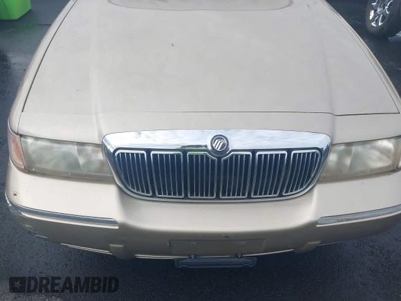 1999 Mercury Grand Marquis GS z VIN 2MEFM74W4XX645430, wystawiony jako IAAI lot #42154522 z przebiegiem 152 306 mil mil oraz . Historia ofert i sprzedaży dostępna na DreamBid. Obrazek 6.