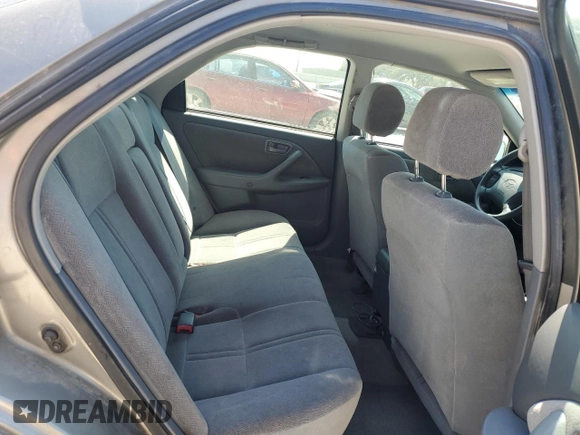 2000 Toyota Camry CE z VIN 4T1BG22K3YU009533, wystawiony jako Copart lot #48996855 z przebiegiem 132 705 mil mil oraz Szkoda całkowita • Salvage title. Historia ofert i sprzedaży dostępna na DreamBid. Obrazek 11.