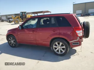2011 Suzuki Grand Vitara Limited z VIN JS3TE0D72B4100054, wystawiony jako Copart lot #52535705 z przebiegiem 131 468 mil mil oraz Szkoda całkowita • Salvage title. Historia ofert i sprzedaży dostępna na DreamBid. Obrazek 2.