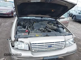 2003 Ford Crown Victoria LX z VIN 2FAFP74W13X120754, wystawiony jako IAAI lot #42212879 z przebiegiem 91 438 mil mil oraz . Historia ofert i sprzedaży dostępna na DreamBid. Obrazek 10.