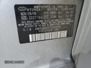 2007 Hyundai Elantra GLS z VIN KMHDU46D07U093432, wystawiony jako Copart lot #53382125 z przebiegiem 181 482 mil mil oraz Szkoda całkowita • Salvage title. Historia ofert i sprzedaży dostępna na DreamBid. Obrazek 13.