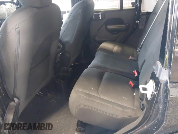 2023 Jeep Wrangler Willys with VIN 1C4HJXDG0PW617101, listed as a IAAI auction lot 42111687 with 56,415 mi miles and . Bid and sale history available at DreamBid. Image 8.