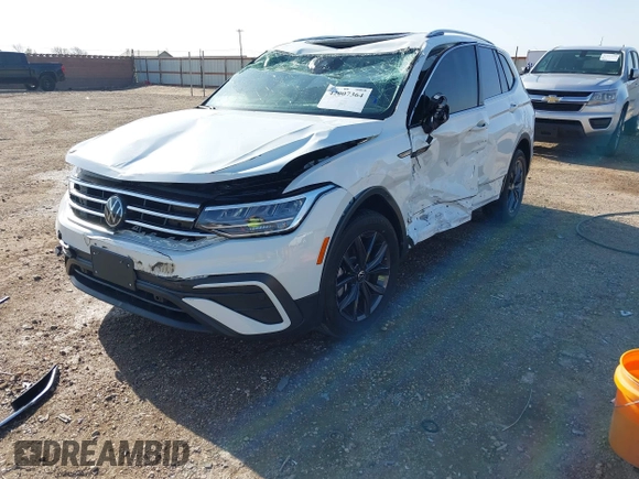 2022 Volkswagen Tiguan SE with VIN 3VV2B7AX2NM010932, listed as a IAAI auction lot 42007364 with 26,014 mi miles and . Bid and sale history available at DreamBid. Image 2.