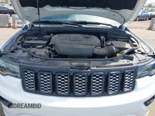 2021 Jeep Grand Cherokee Laredo E with VIN 1C4RJEAG2MC785168, listed as a IAAI auction lot 42115460 with 64,036 mi miles and . Bid and sale history available at DreamBid. Image 10.