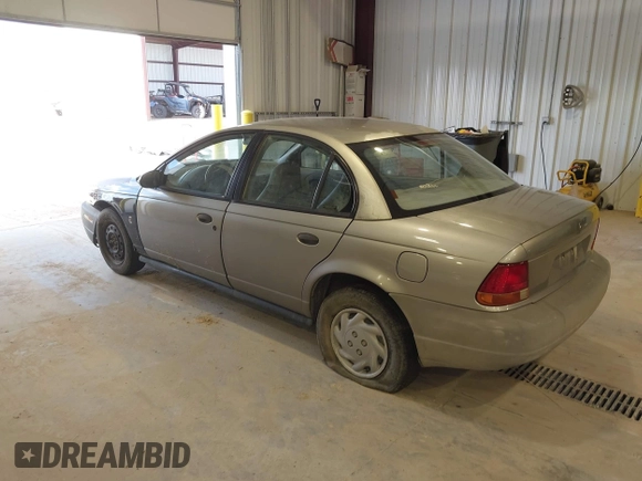 1999 Saturn SL z VIN 1G8ZF5287XZ157353, wystawiony jako IAAI lot #42310900 z przebiegiem 372 049 mil mil oraz . Historia ofert i sprzedaży dostępna na DreamBid. Obrazek 3.