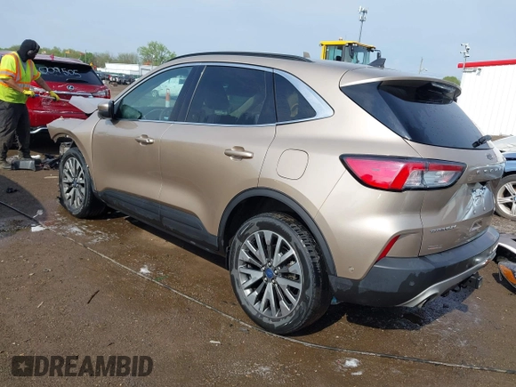 2020 Ford Escape Titanium z VIN 1FMCU9J92LUB48243, wystawiony jako IAAI lot #42143038 z przebiegiem 63 172 mil mil oraz . Historia ofert i sprzedaży dostępna na DreamBid. Obrazek 3.
