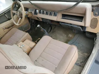 1988 Jeep Wrangler z VIN 2BCCV81M2JB518868, wystawiony jako Copart lot #57649935 z przebiegiem 192 317 mil mil oraz Czysty tytuł • Clean title. Historia ofert i sprzedaży dostępna na DreamBid. Obrazek 8.
