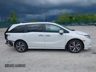 2023 Honda Odyssey Touring with VIN 5FNRL6H88PB079716, listed as a IAAI auction lot 42208628 with 26,679 mi miles and . Bid and sale history available at DreamBid. Image 14.