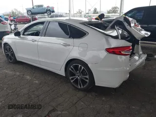 2019 Ford Fusion Titanium with VIN 3FA6P0K90KR236674, listed as a IAAI auction lot 42008633 with 99,737 mi miles and . Bid and sale history available at DreamBid. Image 3.