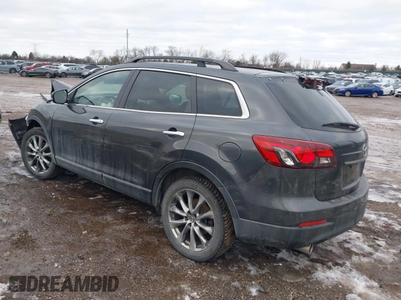 2015 Mazda CX-9 Grand Touring with VIN JM3TB2DAXF0447537, listed as a IAAI auction lot 41191694 with 157,113 mi miles. Bid and sale history available at carsss.com. Image 3.