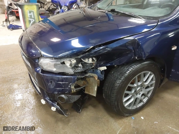 2013 Mitsubishi Lancer SE with VIN JA32V2FW9DU005616, listed as a IAAI auction lot 41247087 with 129,055 mi miles. Bid and sale history available at carsss.com. Image 6.