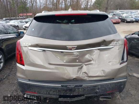 2023 Cadillac XT5 FWD Luxury z VIN 1GYKNAR45PZ140440, wystawiony jako IAAI lot #41723317 z przebiegiem 25 124 mil mil oraz . Historia ofert i sprzedaży dostępna na DreamBid. Obrazek 16.