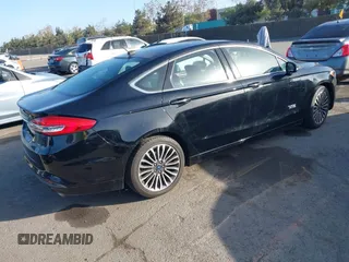 2017 Ford Fusion Energi SE with VIN 3FA6P0PU0HR129792, listed as a IAAI auction lot 41104376 with 86,659 mi miles. Bid and sale history available at carsss.com. Image 4.