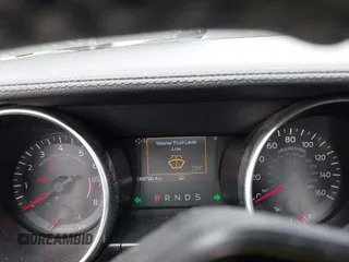 2020 Ford Mustang EcoBoost z VIN 1FA6P8TH2L5186210, wystawiony jako IAAI lot #42103657 z przebiegiem 68 790 mil mil oraz . Historia ofert i sprzedaży dostępna na DreamBid. Obrazek 7.