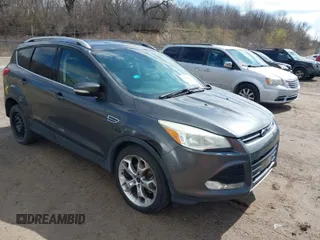 2015 Ford Escape Titanium with VIN 1FMCU0J91FUB74896, listed as a IAAI auction lot 41919609 with 135,363 mi miles. Bid and sale history available at carsss.com. Image 1.