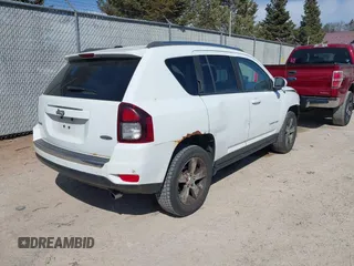 2016 Jeep Compass High Altitude with VIN 1C4NJDEB4GD767731, listed as a IAAI auction lot 41977400 with 99,890 mi miles and . Bid and sale history available at DreamBid. Image 4.