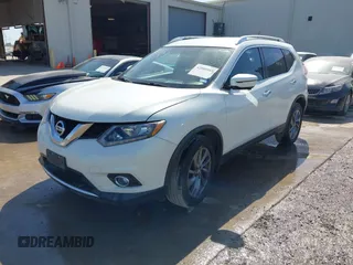 2016 Nissan Rogue SV with VIN KNMAT2MT1GP686630, listed as a IAAI auction lot 42000985 with 131,058 mi miles. Bid and sale history available at carsss.com. Image 2.