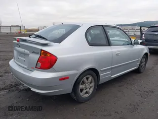 2005 Hyundai Accent GLS with VIN KMHCG35C25U359293, listed as a IAAI auction lot 41233474 with 148,344 mi miles. Bid and sale history available at carsss.com. Image 4.