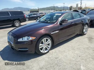 2014 Jaguar XJ with VIN SAJWA1CZ3E8V69877, listed as a Copart auction lot 51520405 with 57,567 mi miles and Clean Title. Bid and sale history available at DreamBid. Image 1.